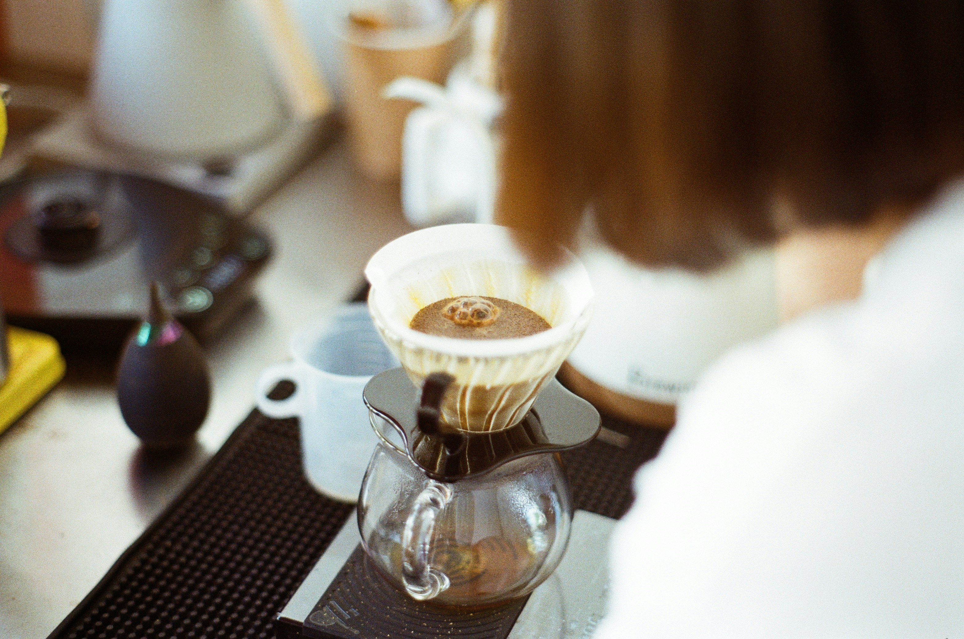 clear glass cup on black and silver coffee maker